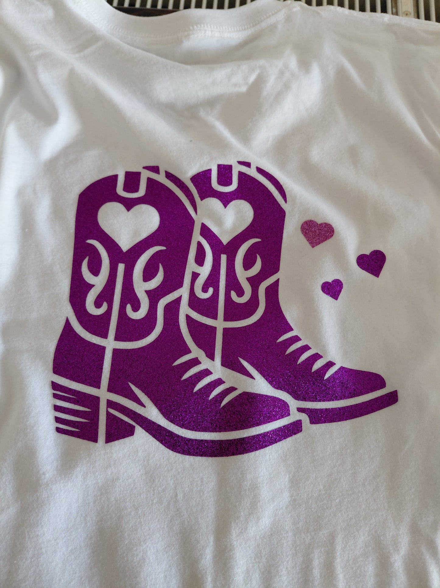 Line dancing t-shirt with purple boots and hearts in glitter vinyl on a white v neck t-shirt. Designed by Kirsty Tulk Tees.