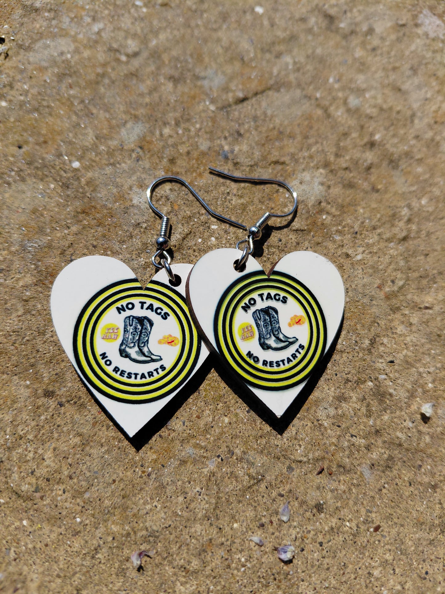 heart shaped line dancing earrings with yellow and black writing, No tags and No restarts.