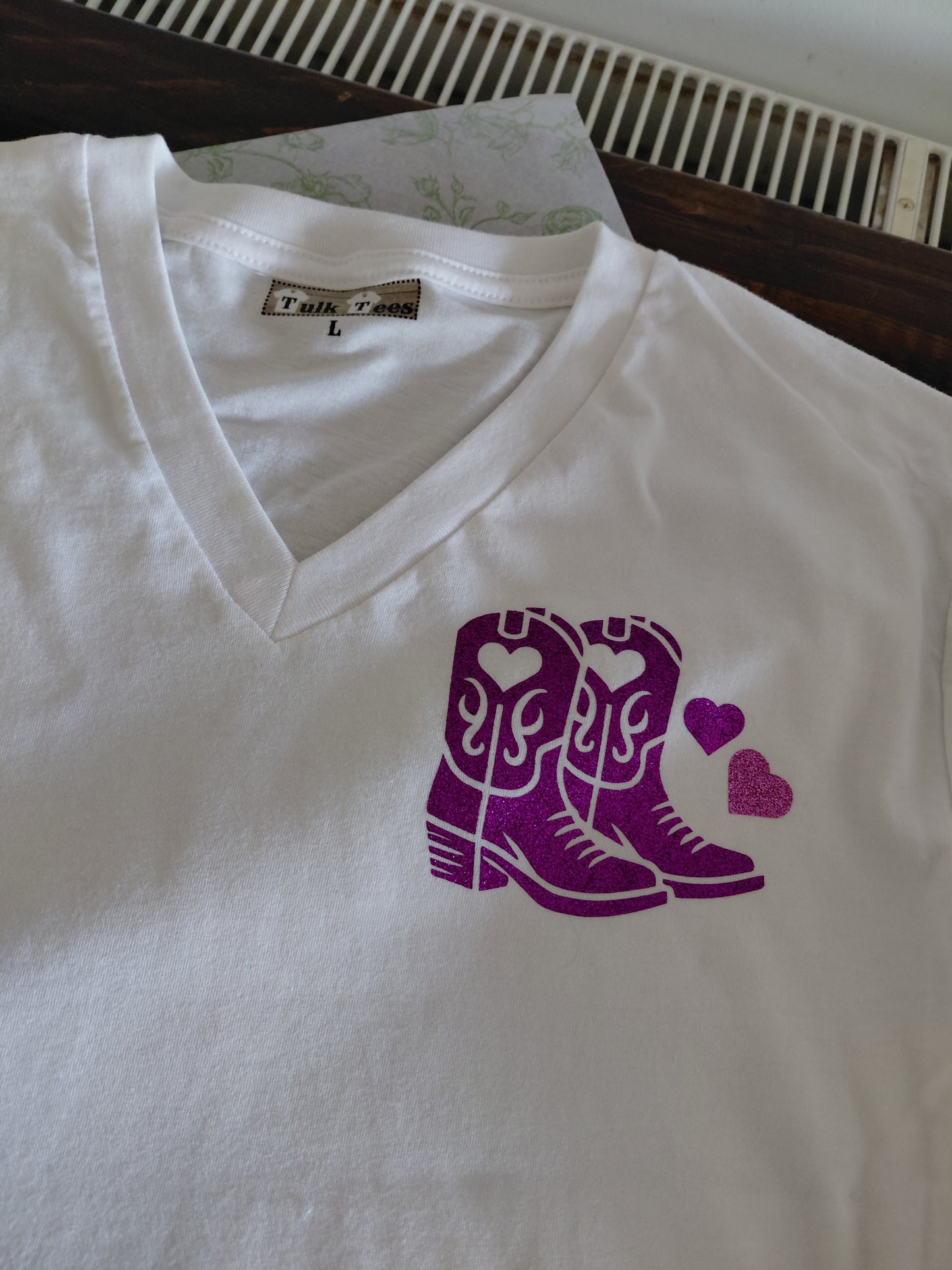 White vneck line dancing t-shirt with puple glitter boots, small on the front and a large one on the back